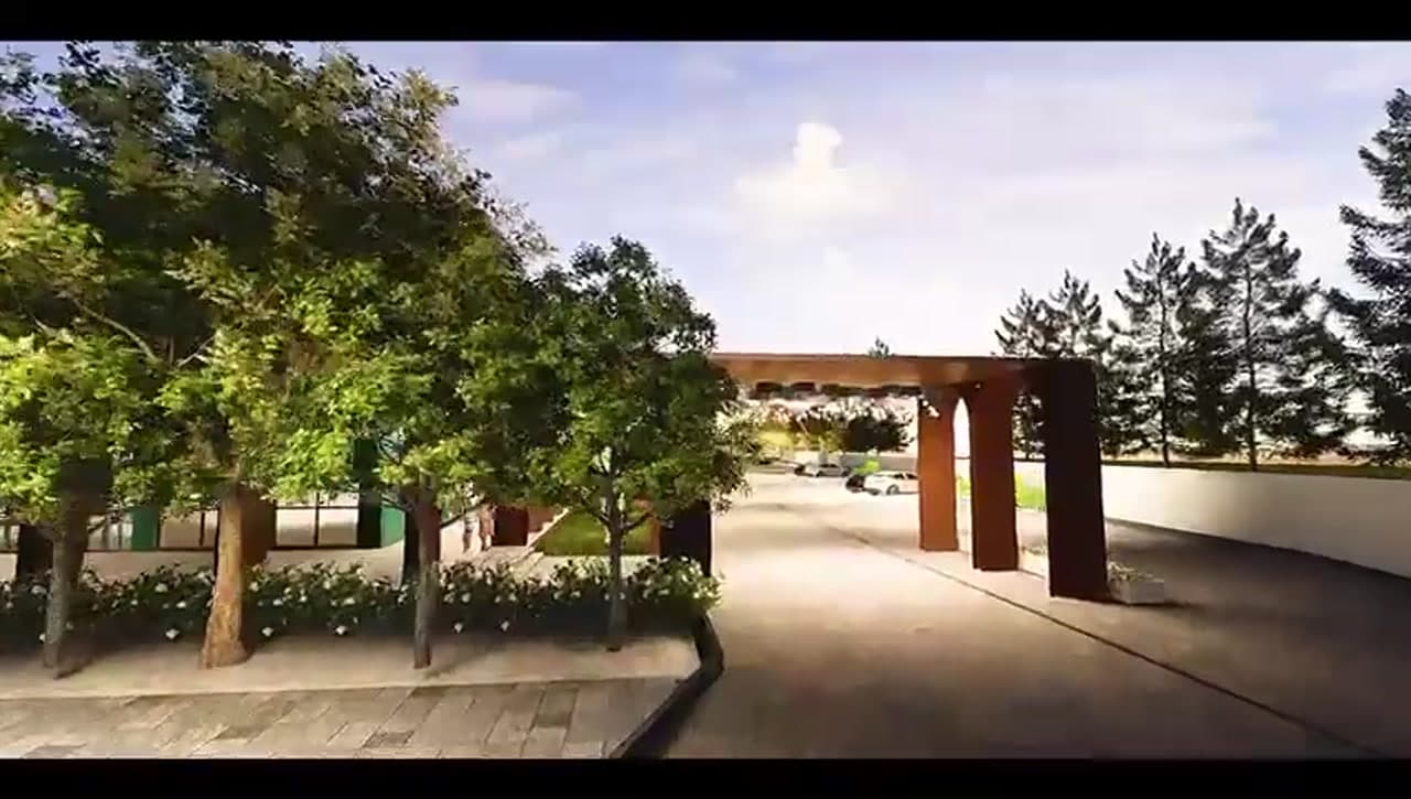 Grand entrance gate with wooden pillars and landscaping